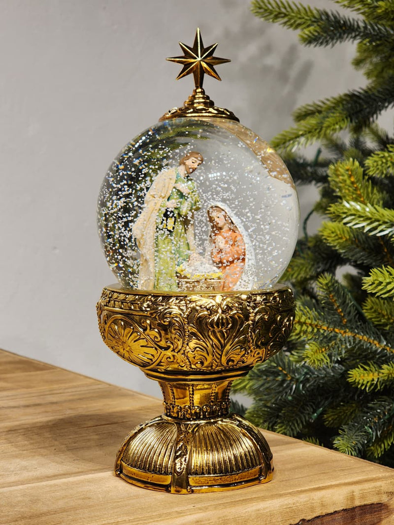 GLOBO DE NEVE COM SAGRADA FAMÍLIA DOURADO LUZ E MOVIMENTO 26,5CM